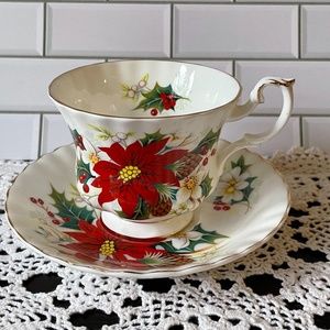 Royal Albert Poinsettia saucer and tea cup. Bone China made in England.